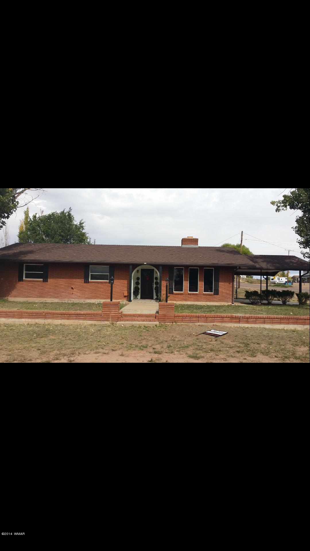 830 Cattle Lane Taylor, AZ 85939 - Photo 1 of 8 a view of a swimming pool with seating space