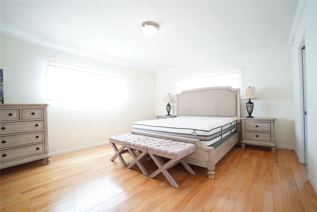 1925 El Sereno Avenue Arcadia, CA 91007 - Photo 20 of 37 a bedroom with a bed and wooden floor