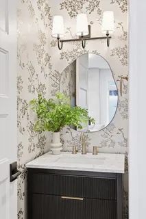 a kitchen with kitchen island stainless steel appliances a sink stove and cabinets