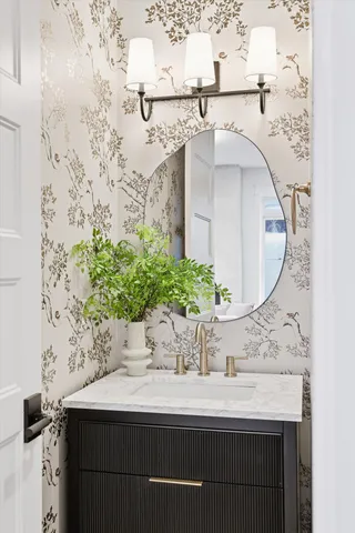 a kitchen with kitchen island stainless steel appliances a sink stove and cabinets