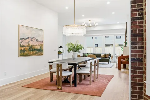 a bedroom with furniture and a potted plant