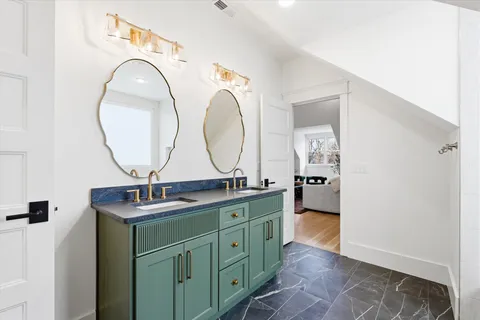 a view of a house with backyard and a tree