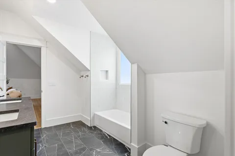 a view of a chairs and table in backyard of the house