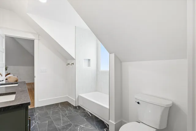a view of a chairs and table in backyard of the house
