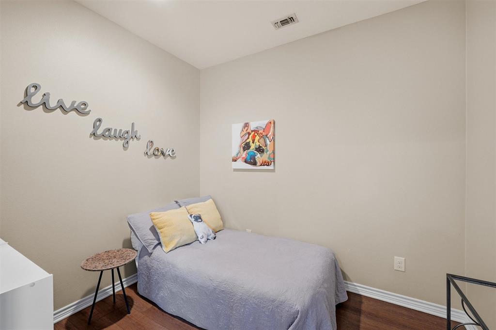 15656 South State Highway 78 Blue Ridge, TX 75424 - Photo 24 of 36 a bedroom with a bed and a table in it