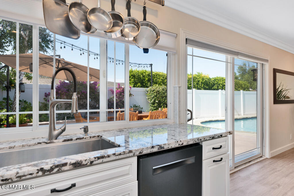 2685 Velarde Drive Thousand Oaks, CA 91360 - Photo 13 of 40 a kitchen with granite countertop a sink and a large window