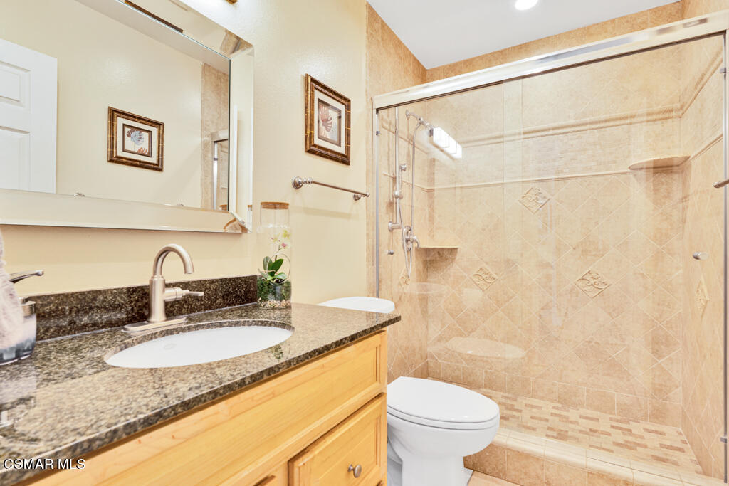 2685 Velarde Drive Thousand Oaks, CA 91360 - Photo 17 of 40 a bathroom with a granite countertop sink toilet and shower