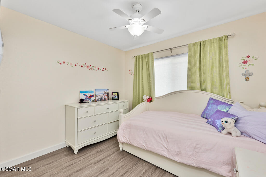 2685 Velarde Drive Thousand Oaks, CA 91360 - Photo 20 of 40 a bedroom with a bed and a chandelier