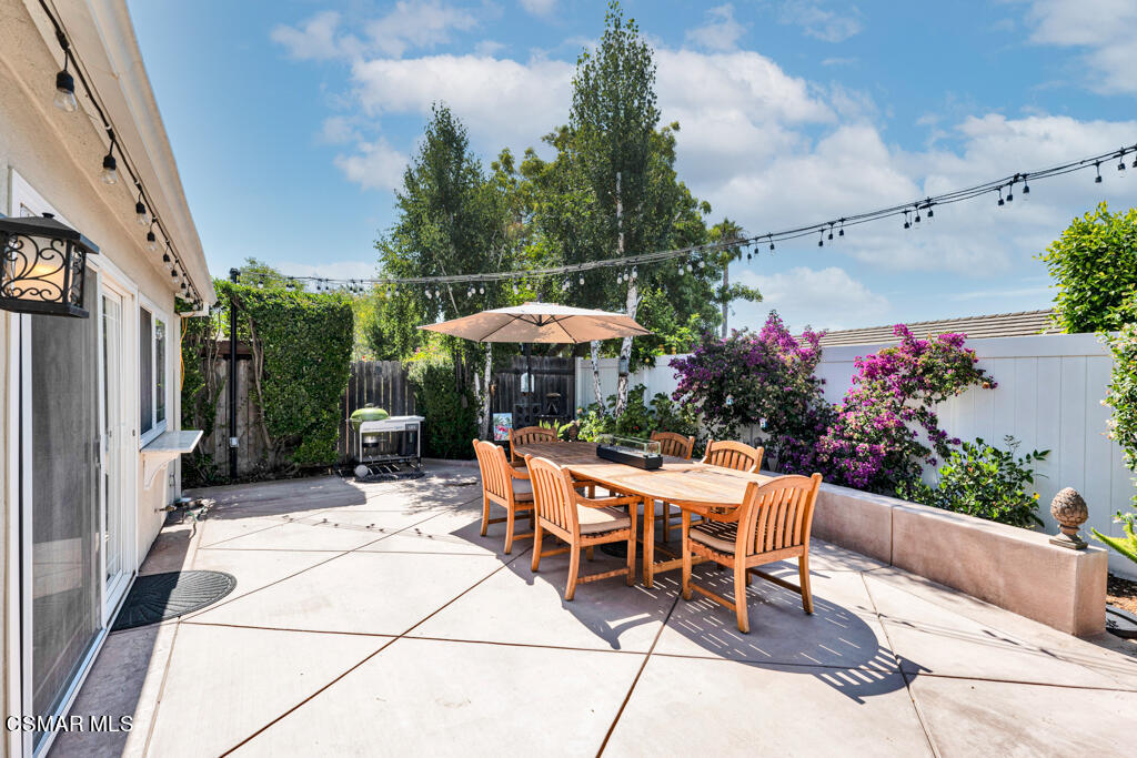 2685 Velarde Drive Thousand Oaks, CA 91360 - Photo 30 of 40 a view of a patio with a table and chairs in front of a house