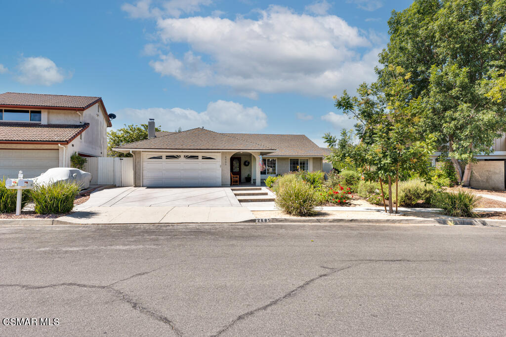 2685 Velarde Drive Thousand Oaks, CA 91360 - Photo 35 of 40 a front view of a house with a yard and garage