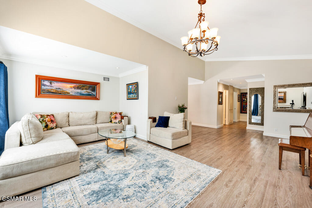 2685 Velarde Drive Thousand Oaks, CA 91360 - Photo 7 of 40 a living room with furniture or chandelier and a wooden floor