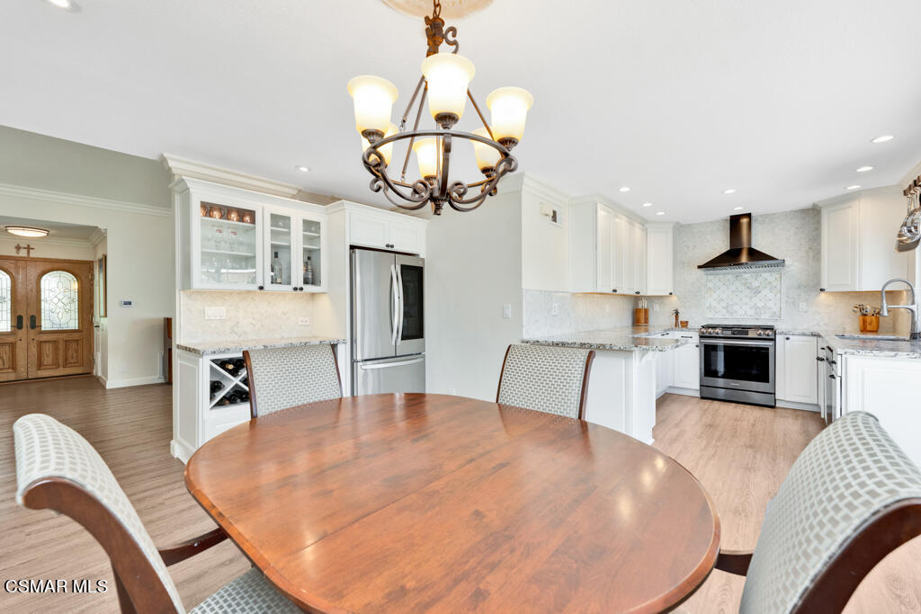 2685 Velarde Drive Thousand Oaks, CA 91360 - Photo 9 of 40 a living room with furniture a dining table and kitchen view