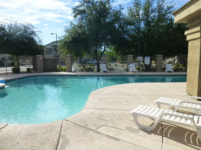 a view of a patio with swimming pool