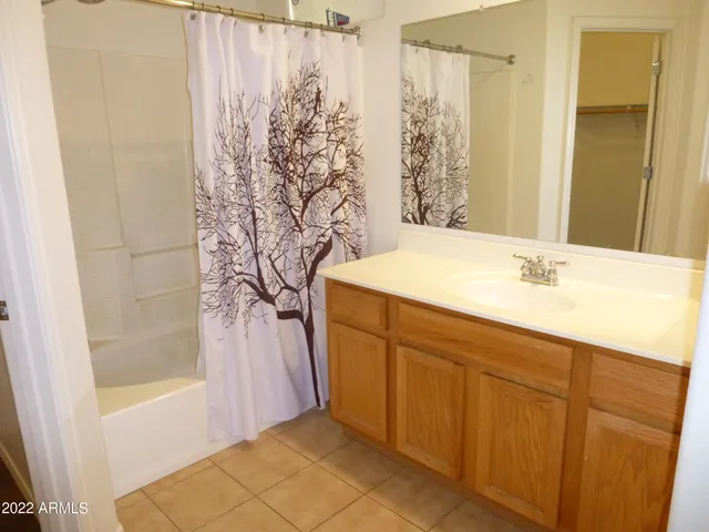 a bedroom with a bed and a table