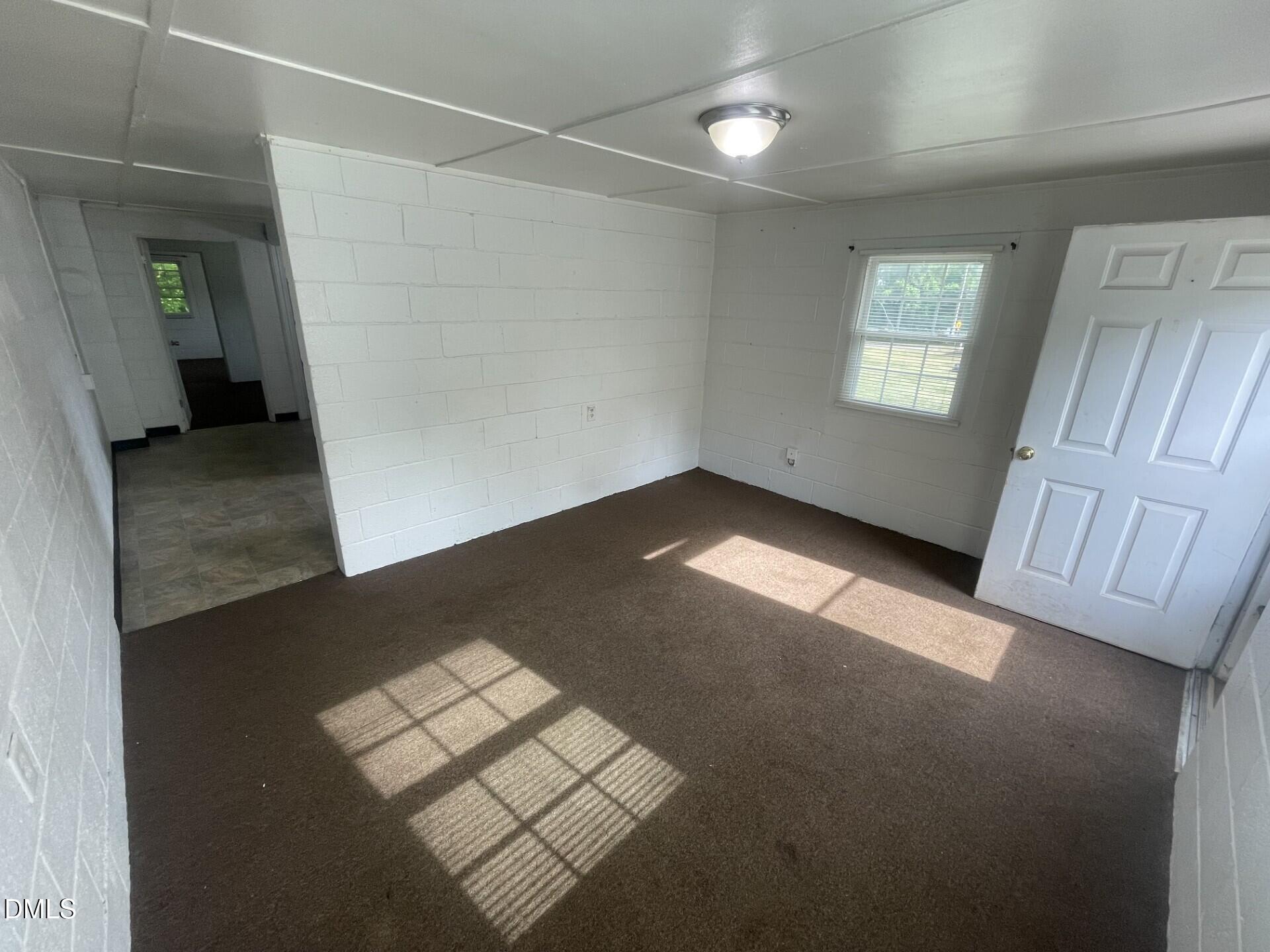 1119 Gregg Street Raleigh, NC 27601 - Photo 12 of 12 an empty room with windows