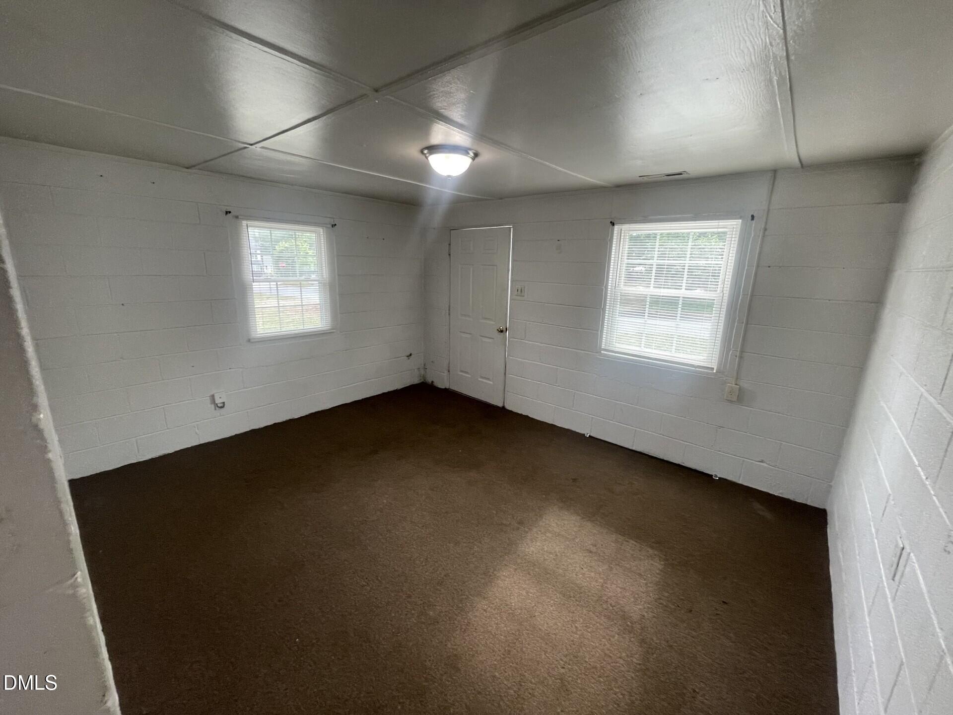1119 Gregg Street Raleigh, NC 27601 - Photo 7 of 12 an empty room with a window