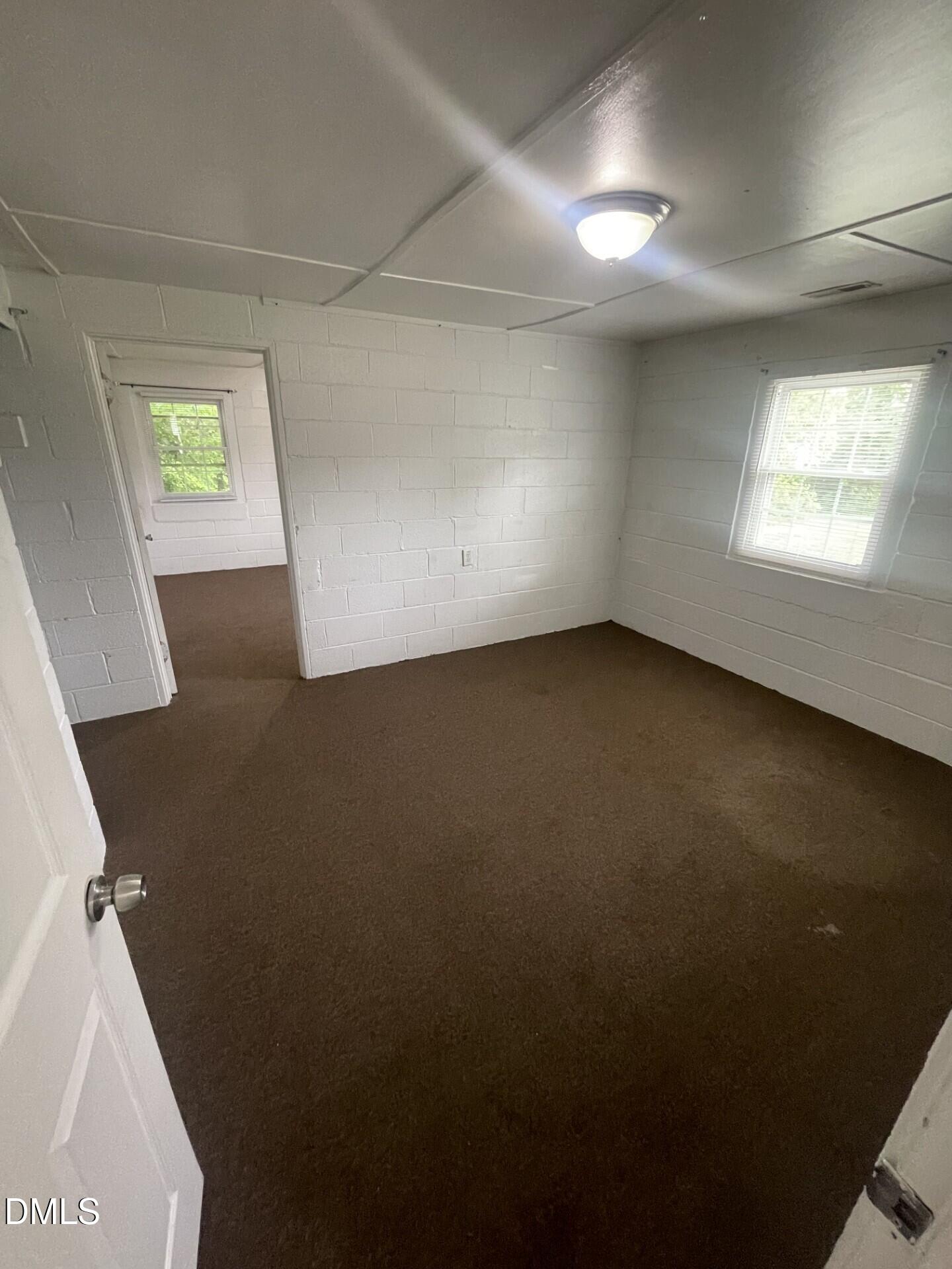 1119 Gregg Street Raleigh, NC 27601 - Photo 8 of 12 an empty room with a window