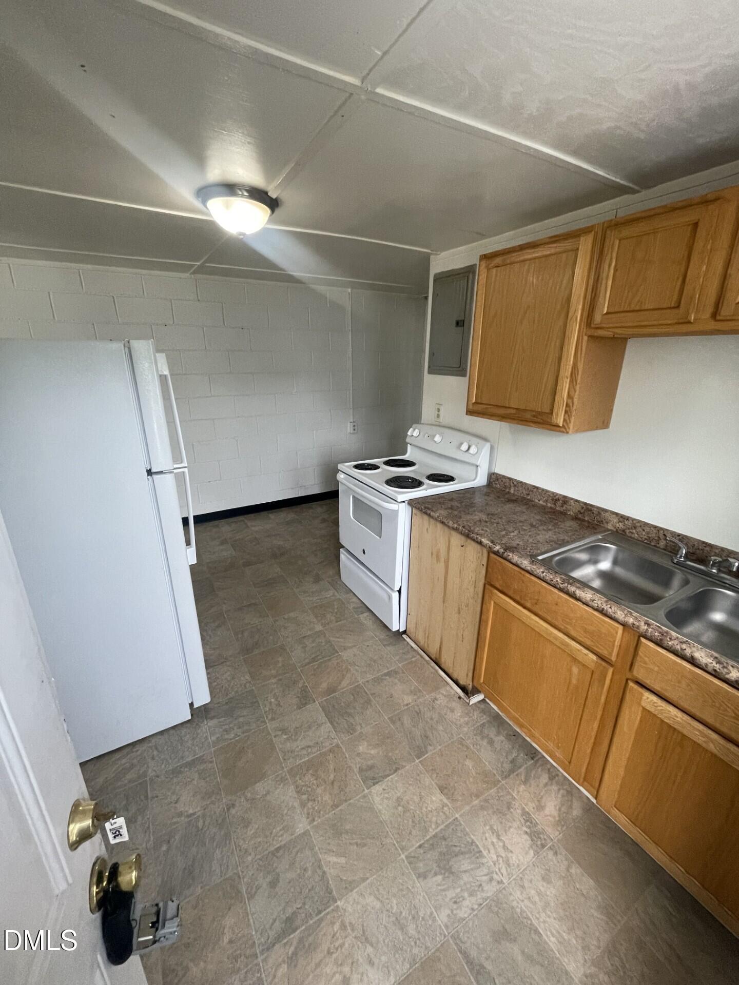 1119 Gregg Street Raleigh, NC 27601 - Photo 9 of 12 a kitchen with a stove and a refrigerator