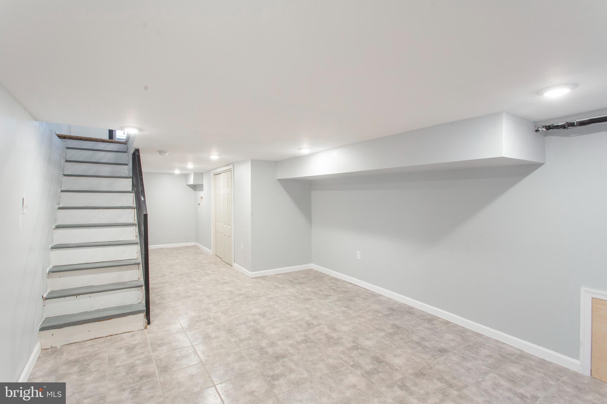 5330 Pentridge Street Philadelphia, PA 19143 - Photo 12 of 14 a view of a room with stairs and a hallway