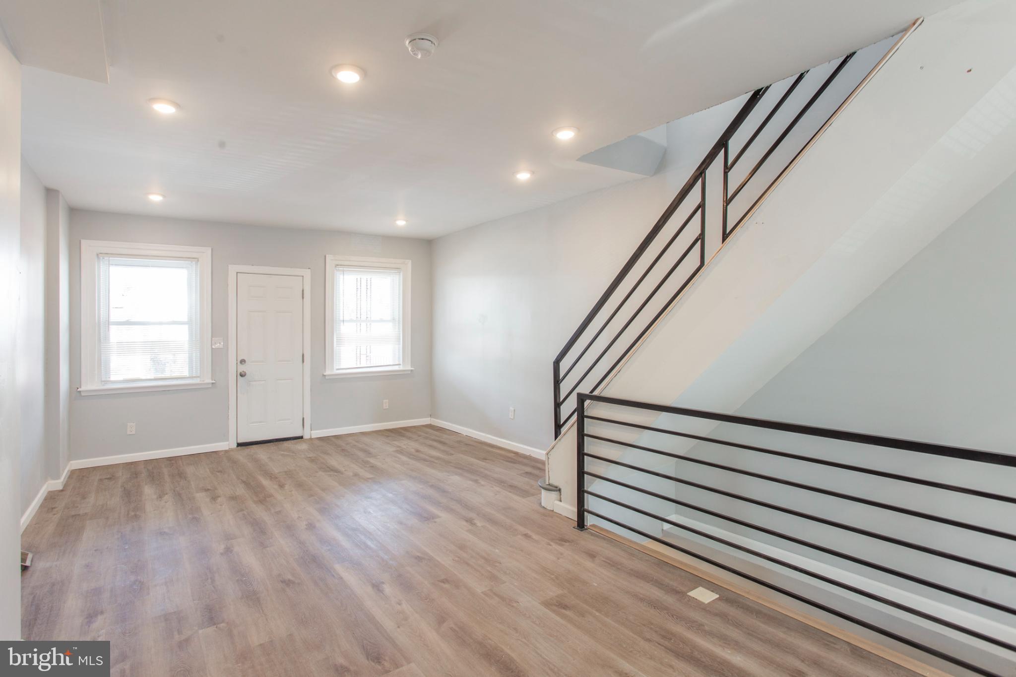 5330 Pentridge Street Philadelphia, PA 19143 - Photo 5 of 14 wooden floor in an empty room with a window