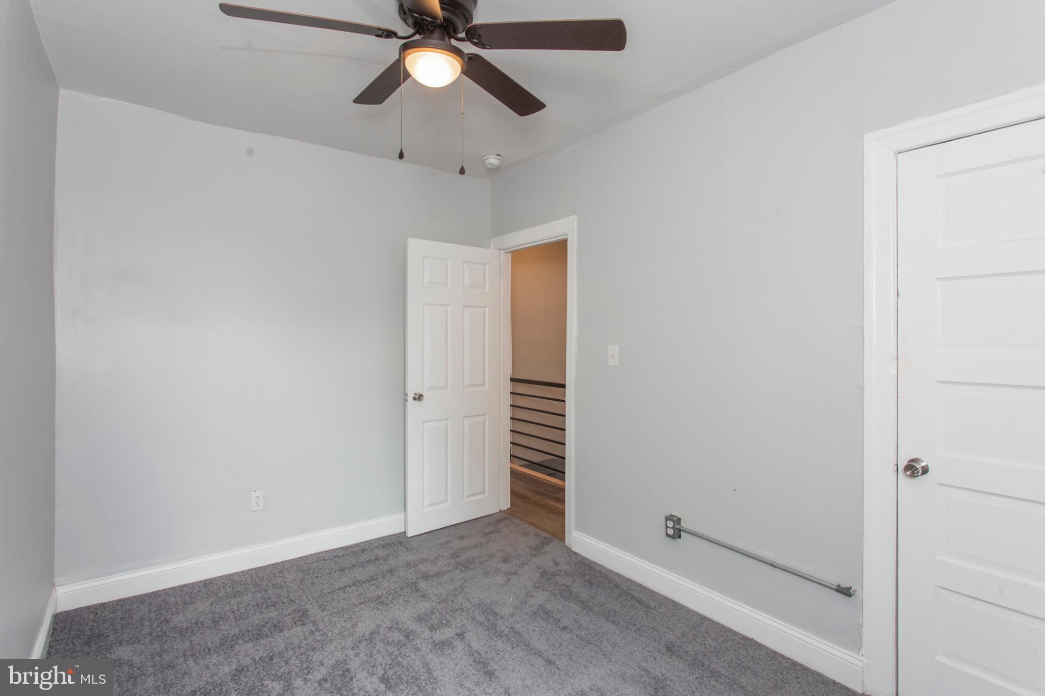 5330 Pentridge Street Philadelphia, PA 19143 - Photo 9 of 14 an empty room with closet and a chandelier fan