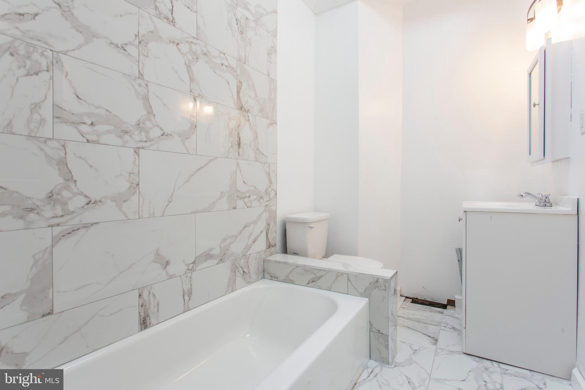 5330 Pentridge Street Philadelphia, PA 19143 - Photo 10 of 14 a bathroom with sink and bathtub