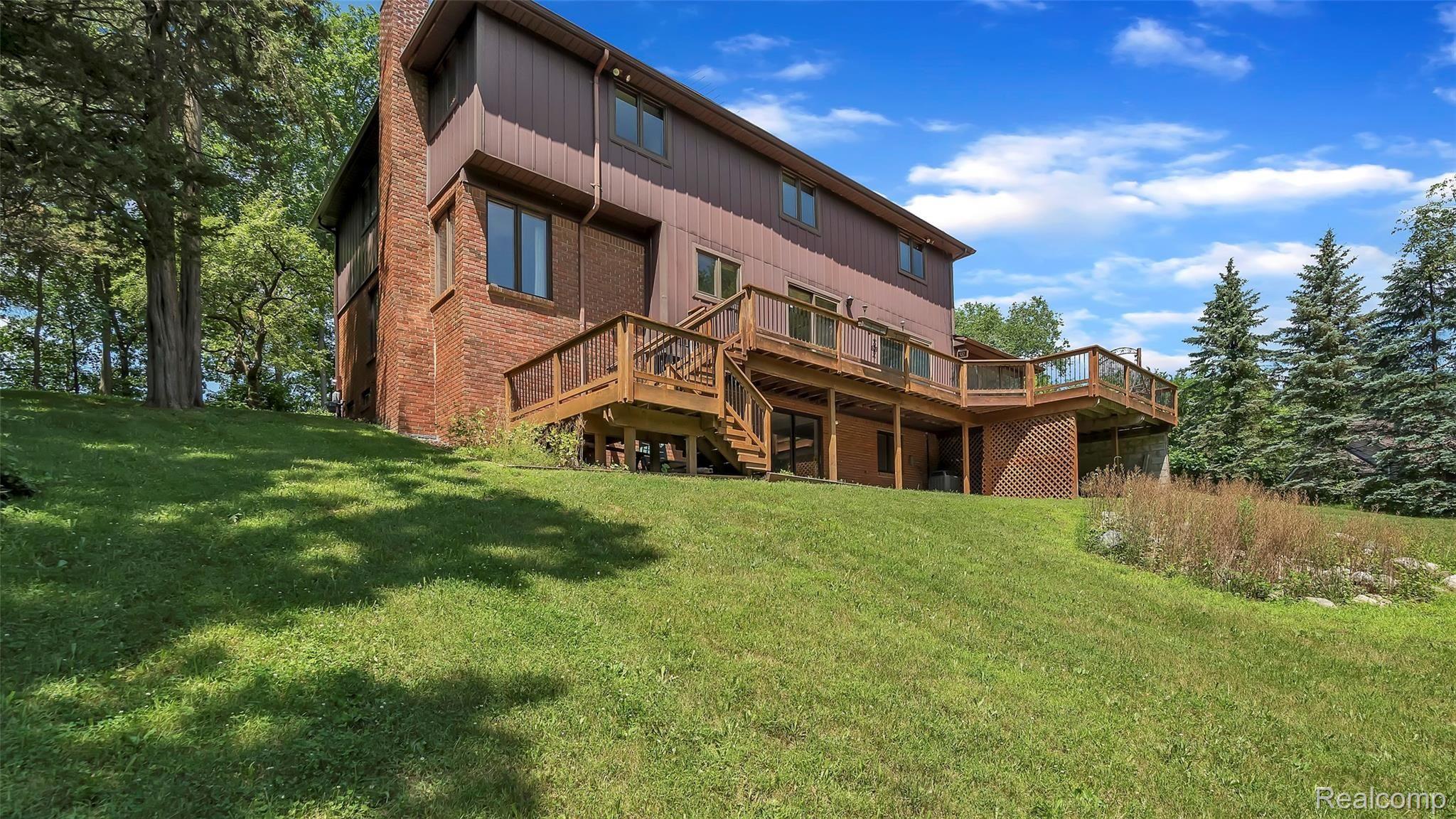 5207 Mountain Road Brighton, MI 48116 - Photo 2 of 42 Back view-extensive decking
