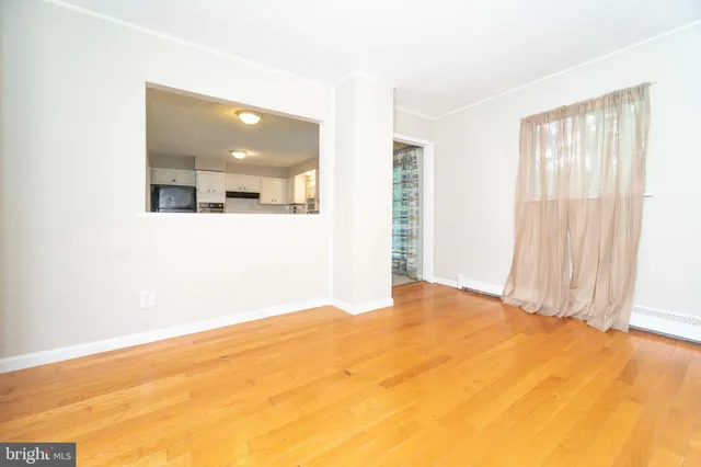 a view of an empty room with a window