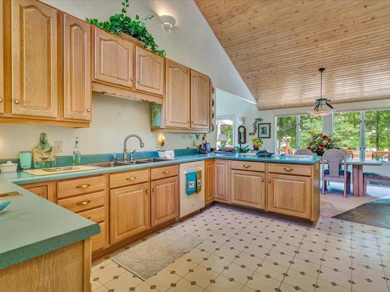 121 Spring Drive Huddleston, VA 24104 - Photo 20 of 70 a kitchen with stainless steel appliances granite countertop a sink and cabinets