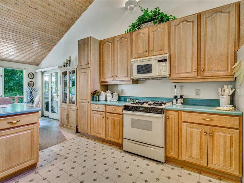 121 Spring Drive Huddleston, VA 24104 - Photo 21 of 70 a kitchen with stainless steel appliances granite countertop a stove a sink and a refrigerator