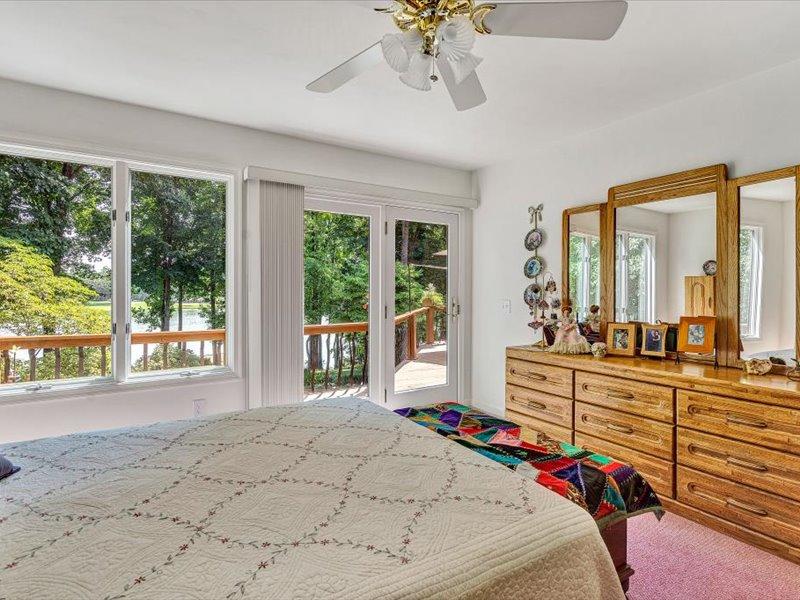 121 Spring Drive Huddleston, VA 24104 - Photo 26 of 70 a very nice looking room with a large window and a chandelier