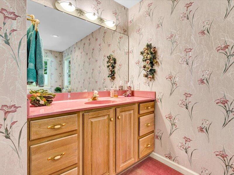 121 Spring Drive Huddleston, VA 24104 - Photo 28 of 70 a bathroom with a granite countertop sink a mirror and shower curtain