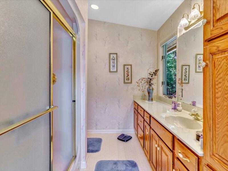 121 Spring Drive Huddleston, VA 24104 - Photo 36 of 70 a bathroom with a sink a mirror and a shower