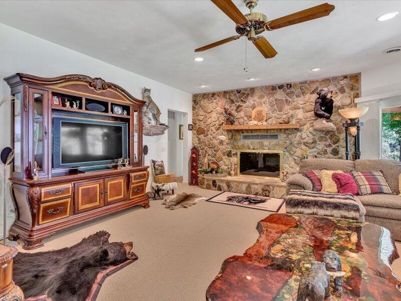 121 Spring Drive Huddleston, VA 24104 - Photo 38 of 70 a living room with furniture and a flat screen tv