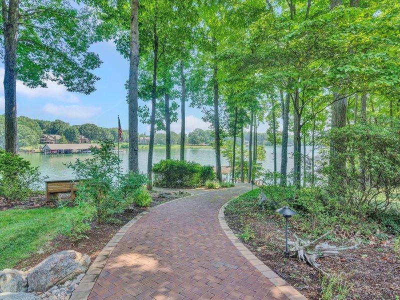 121 Spring Drive Huddleston, VA 24104 - Photo 53 of 70 a view of a garden with plants and large trees