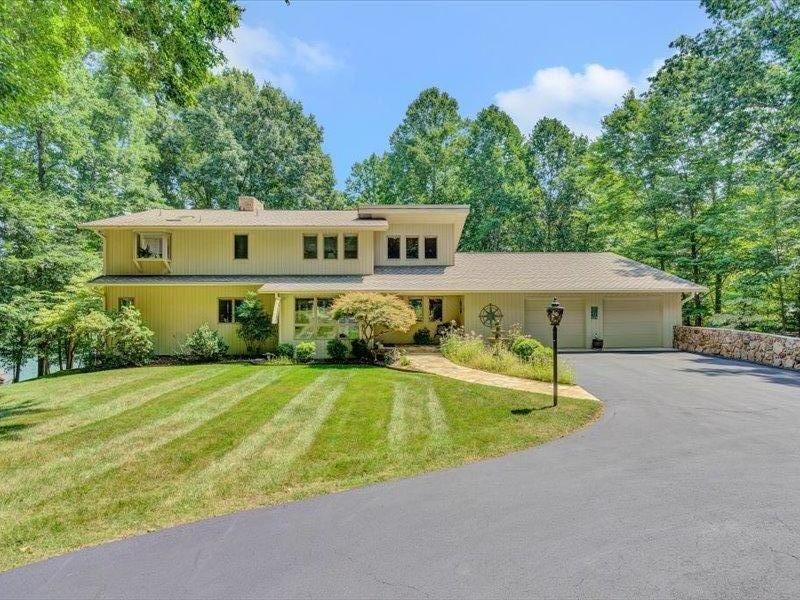 121 Spring Drive Huddleston, VA 24104 - Photo 67 of 70 a front view of a house with yard and green space
