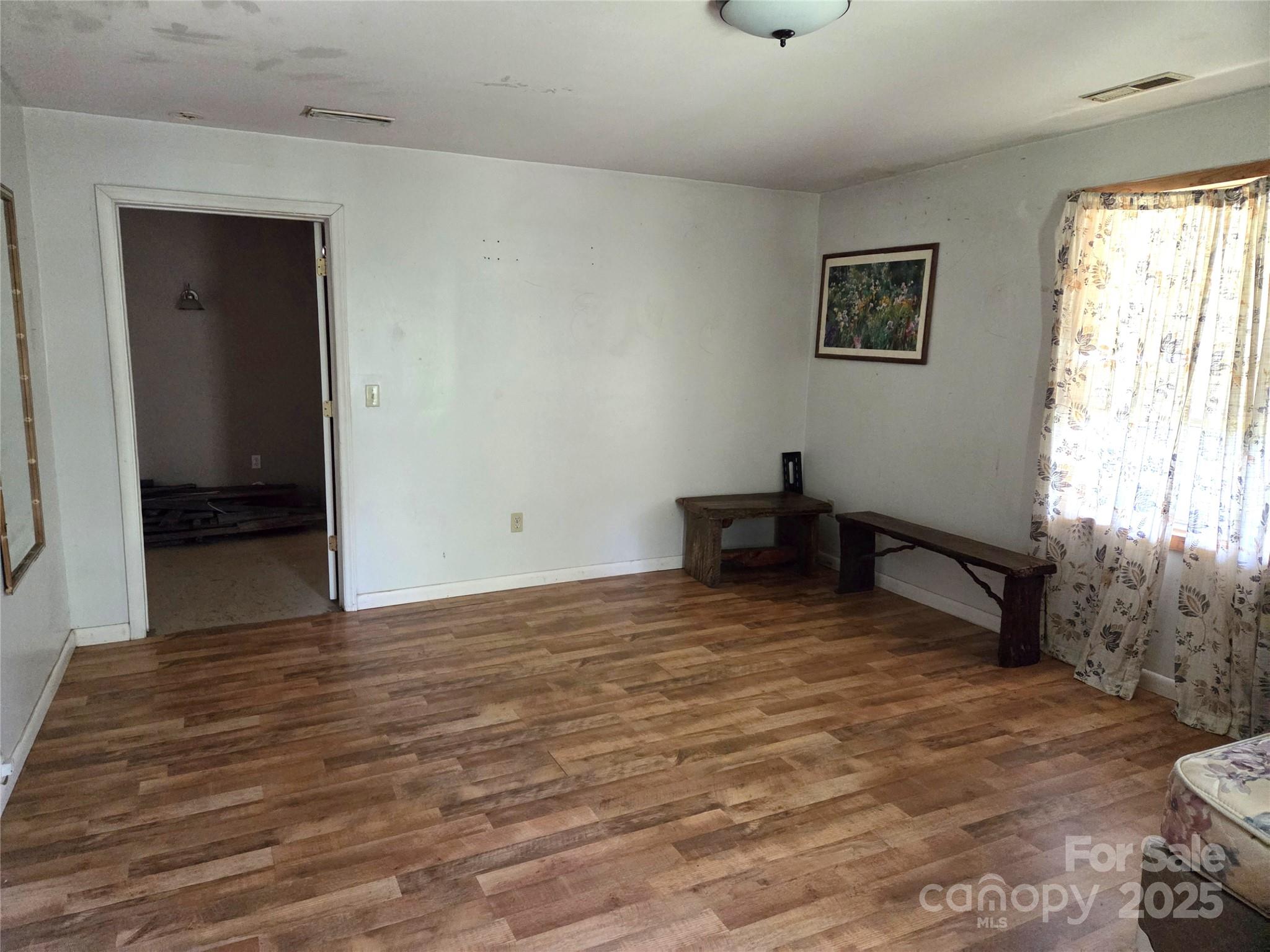 68 Garden Ridge Clyde, NC 28721 - Photo 11 of 16 a room with a bench and a window
