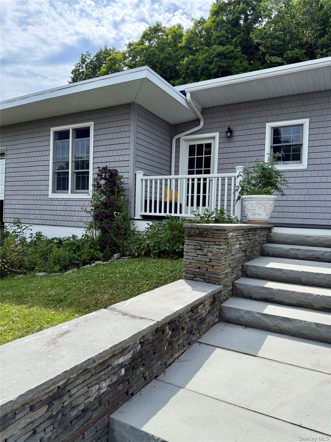 91-97 Sawmill Road Red Hook, NY 12571 - Photo 1 of 11 a front view of house with yard and green space