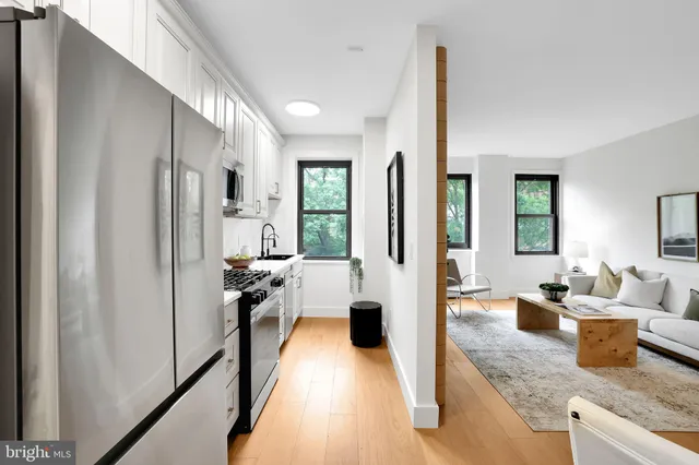 a view of a living room and hardwood floor