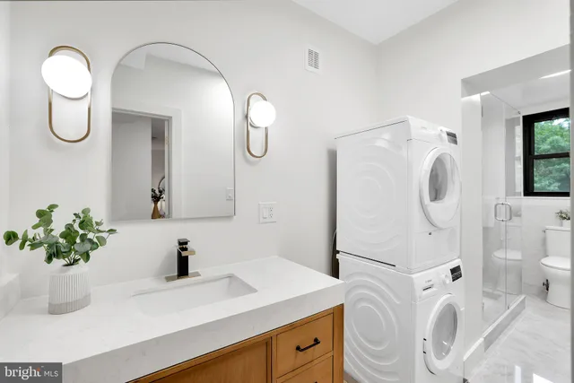 a bathroom with a sink a vanity and mirror