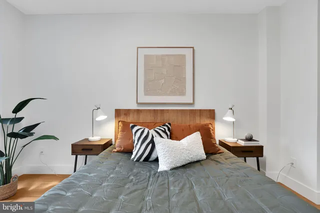 a bedroom with a bed and a table