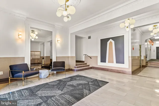 a living room with fireplace furniture and a window