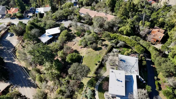an aerial view of residential house with outdoor space