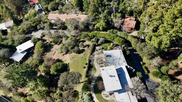 an aerial view of residential house with outdoor space