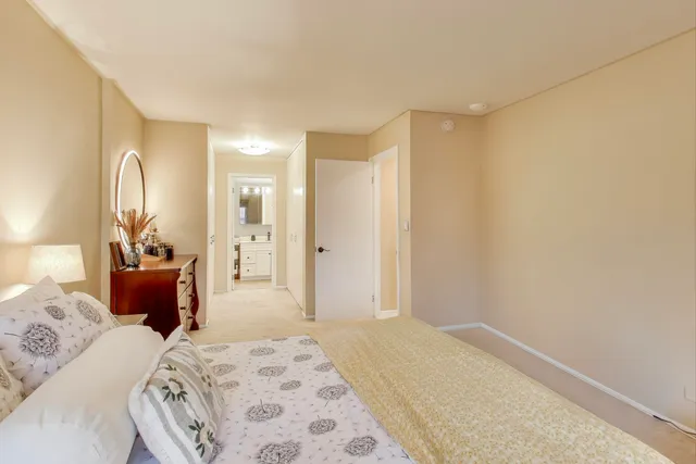 a bedroom with a bed and a couch