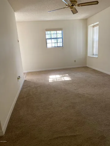 an empty room that has a window in it