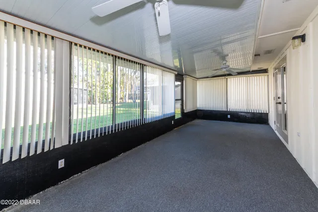 a view of a room with large windows