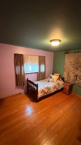 a bed room with a bed and a night stand