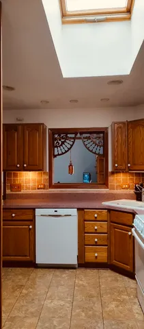 a kitchen with stainless steel appliances granite countertop a stove and a sink