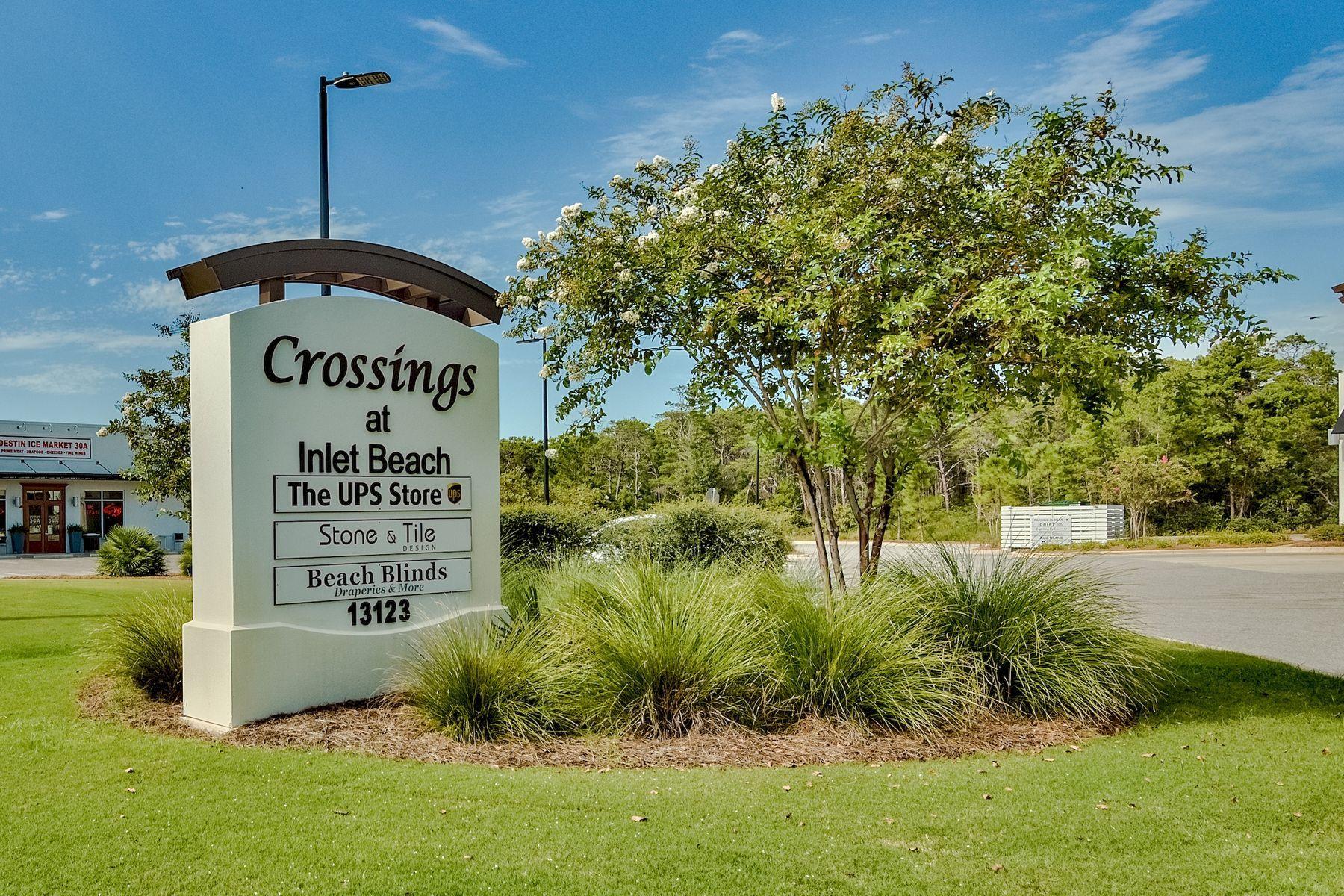 Lot 7 North Wall St Inlet Beach Inlet Beach, FL 32461 - Photo 11 of 18 a view of a sign in a yard with plants